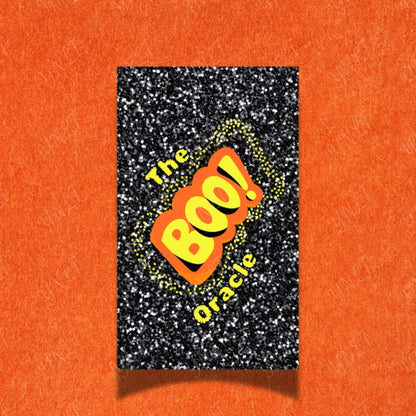 Book titled 'The BOO! Oracle' on a glittery black background with an orange border